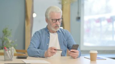 Senior Old Man Shopping Online with Credit Card