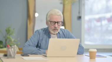 Online Video Chat by Senior Old Man in Office