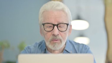 Close Up of Senior Old Man Doing Video Chat on Laptop