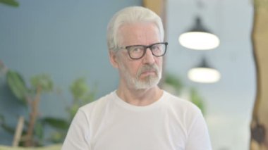 Portrait of Senior Old Man Denying Offer