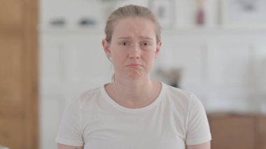 Portrait of Crying Young Woman Feeling Sad at Home