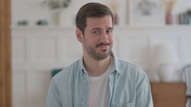 Portrait of Casual Man Shaking Head in Denial