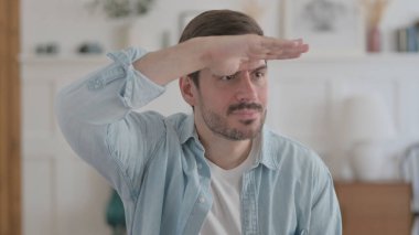 Portrait of Casual Man Looking Around, Searching