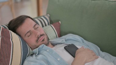 Relaxed Casual Man Sleeping in Bed Peacefully