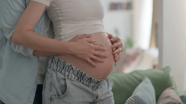 Male Hands Holding Pregnant Woman Big Belly — Foto de Stock