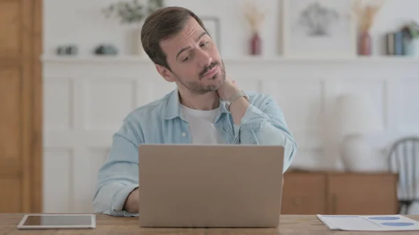 Casual Man Having Neck Pain While Using Laptop — Stockfoto