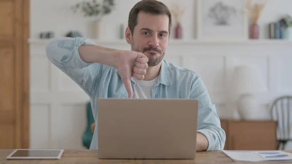 Casual Man Showing Thumbs While Using Laptop —  Fotos de Stock