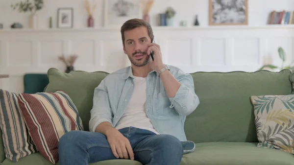 Casual Man Talking Phone Sofa — Stockfoto
