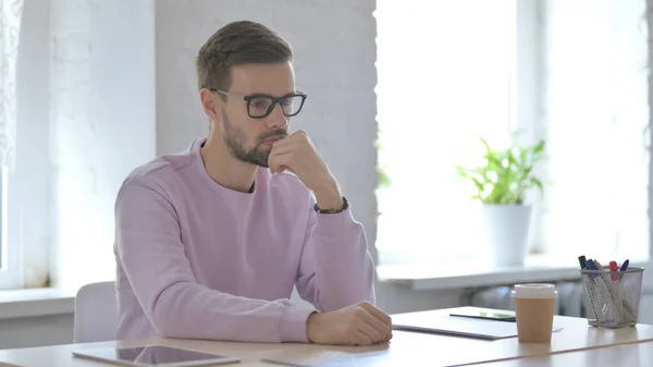 Young Adult Man Thinking While Sitting Office — Stock Photo, Image
