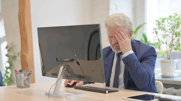 Old Businessman Having Headache While Working Computer — Stok fotoğraf