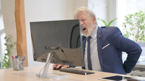 Old Businessman Having Back Pain While Working Computer — Stok fotoğraf