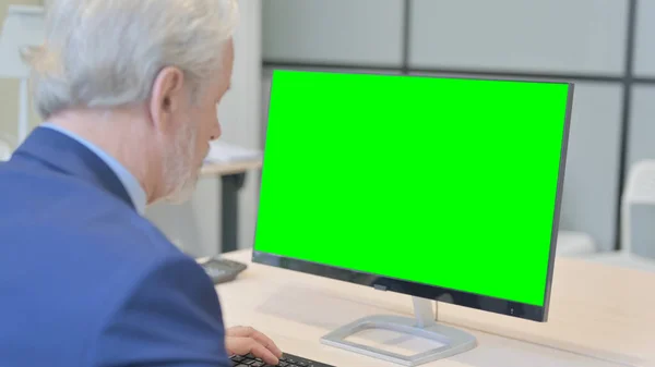 The Old Businessman Using Desktop with Green Screen