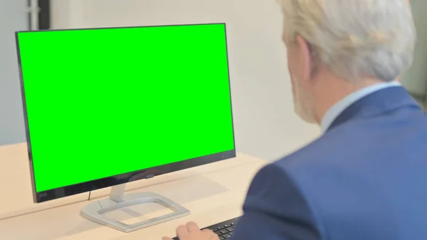 The Old Businessman Working on Computer with Green Screen