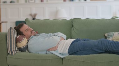 Relaxed Casual Man Sleeping in Bed Peacefully