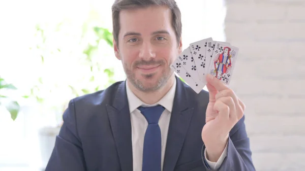 Young Adult Businessman Shuffling Poker Cards Office — Zdjęcie stockowe