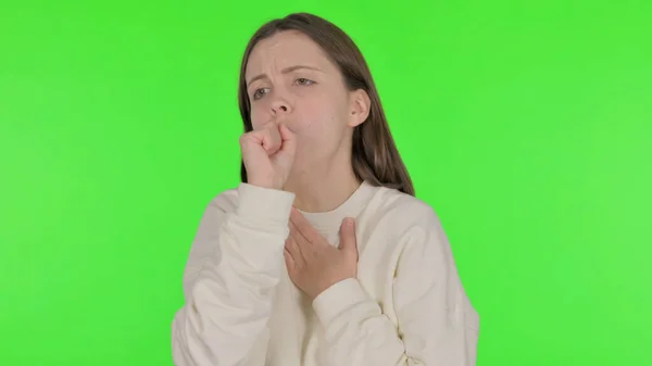 緑の背景に病気のカジュアル女性を咳 — ストック写真