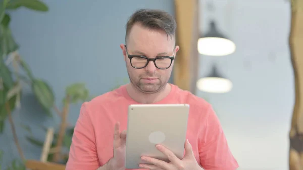 Young Adult Man Browsing Internet Digital Tablet — Stok fotoğraf