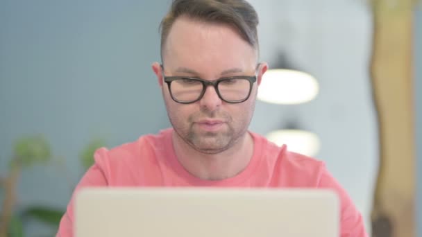 Close Young Adult Man Looking Camera While Using Laptop — Stock video