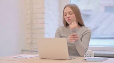 Creative Young Woman with Wrist Pain at Work