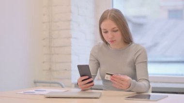 Creative Young Woman Shopping Online with Bank Card