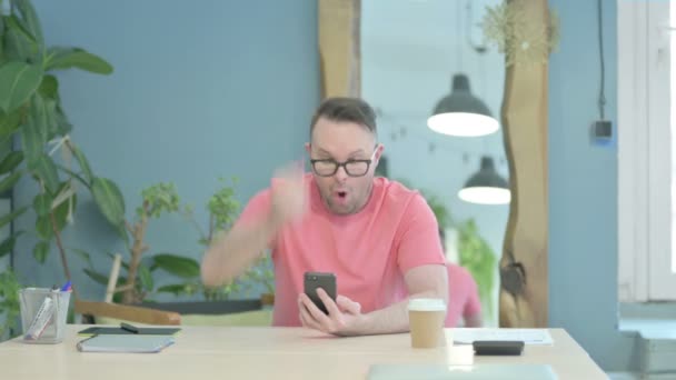 Successful Creative Adult Man Celebrating Win Smartphone — Stockvideo