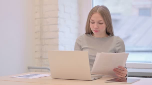 Creative Young Woman Celebrating While Doing Paperwork Laptop — Stockvideo