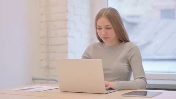 Creative Young Woman Shaking Head Approval While Working Laptop — Stockvideo