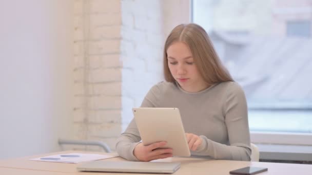 Creative Young Woman Using Tablet Browsing Internet — Stockvideo