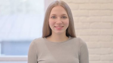 Portrait of Smiling Creative Young Woman