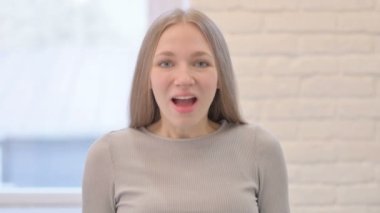 Amazed Woman Claaping in Excitement of Success