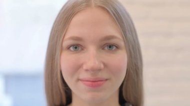 Close Up of Smiling Creative Young Woman