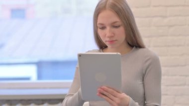 Excited Creative Young Woman Cheering Win on Digital Tablet