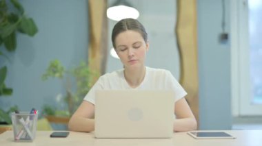 Young Woman Leaving Office after Work