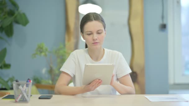 Young Woman Using Tablet Browsing Internet — Stok video