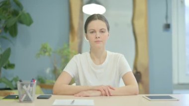 Coughing Young Woman Sitting in Office