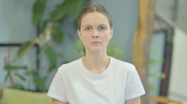 Portrait of Angry Young Adult Woman Arguing in Frustration