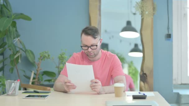 Creative Adult Man Celebrating Success While Reading Documents Office — Αρχείο Βίντεο