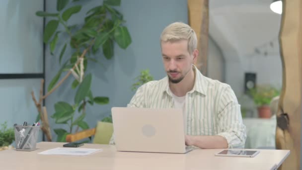 Modern Young Man Smiling Camera While Using Laptop — Video