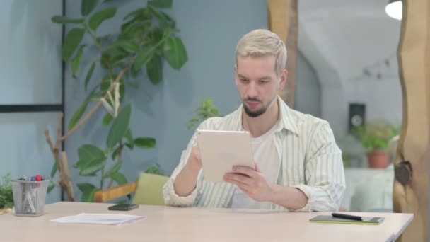 Modern Young Man Using Digital Tablet Browsing Internet — Video
