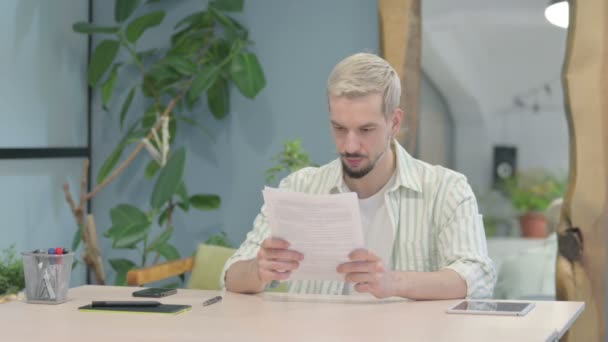 Modern Young Man Celebrating Success While Reading Documents Office — Video Stock