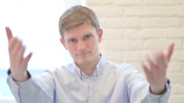 Portrait of Inviting Young Businessman