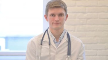 Portrait of Male Doctor Doing Thumbs Up