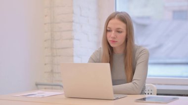 Pensive Creative Young Woman Thinking at Work