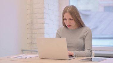 Angry Creative Young Woman Shouting at Work in Frustration