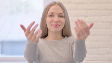 Portrait of Creative Young Woman Inviting People