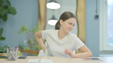 Young Woman with Spinal Back Pain at Work