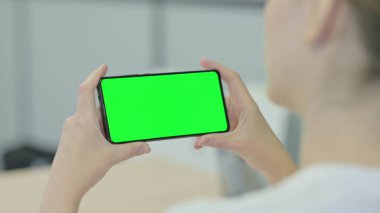 Woman Holding Smartphone with Chroma Key