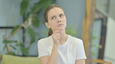 Portrait of Young Woman Thinking an Idea