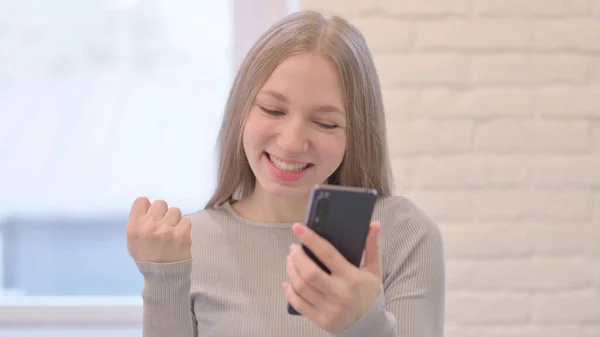 stock image Portrait of Creative Young Woman Celebrating Success on Smartphone