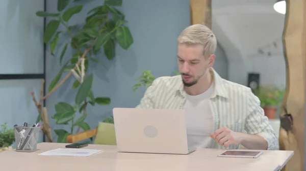 Stock image Modern Young Man Coming Back to Office and Opening Laptop